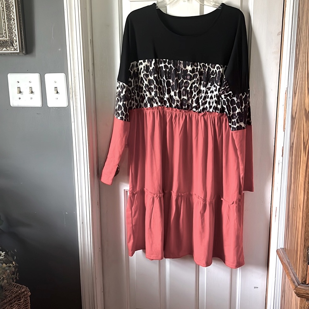 NWOT orange cheetah,black knees length dress never worn.
